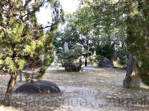 Top of the burial mound with a large stone lying on the ground